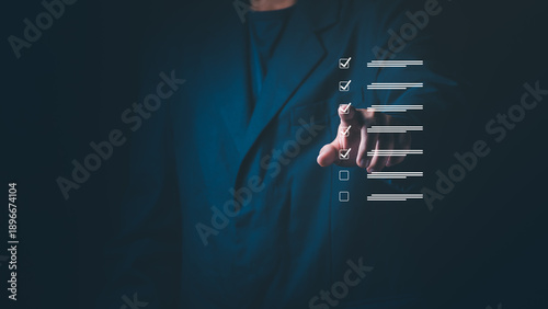 Canvastavla Businessman's hand touching a digital checklist on a virtual screen, Concept of