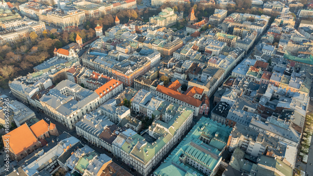 Obraz premium Overhead Aerial View of Dense Residential City Blocks in Krakow During Autumn With Historic Rooftops