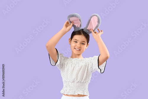 Cute girl in bunny ears on ...