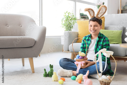 Teenage boy in bunny ears w...