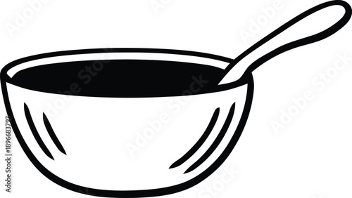 Simple black bowl with a spoon a stark graphic silhouette