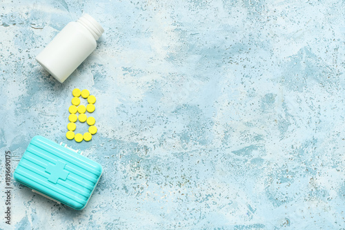 Bottle with yellow vitamin ...