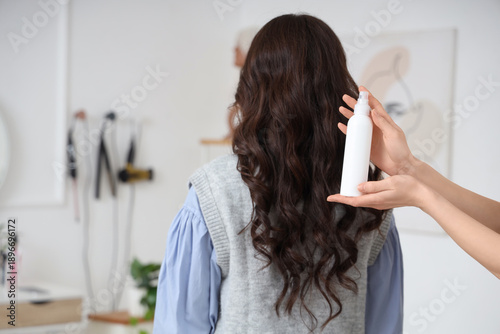 Female hairdresser holding ...