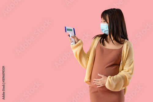 Pregnant Asian woman in med...