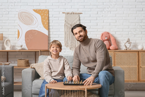 Dad and little son playing ...