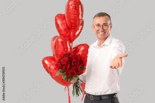 Happy mature man with rose ...