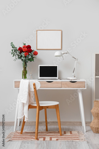 Dahlia flowers in vase on w...