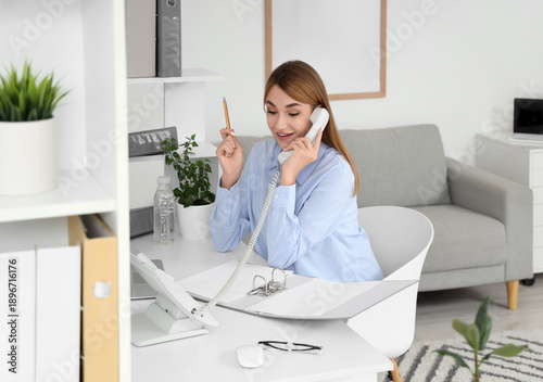 Young businesswoman with do...