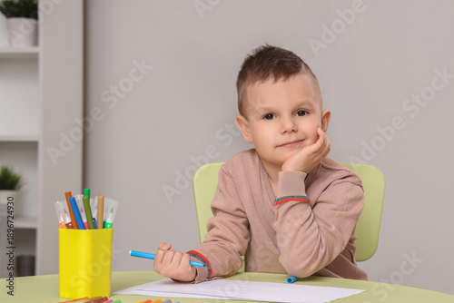 Cute little boy drawing wit...