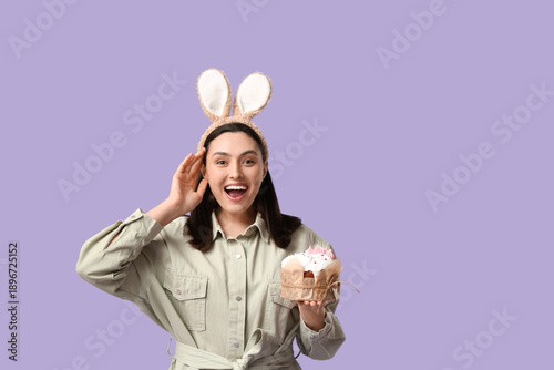 Happy young woman in bunny ...