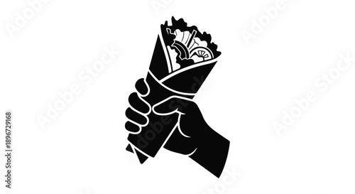 Hand holding delicious freshly made wrap filled with fresh ingredients, perfect for a quick meal.