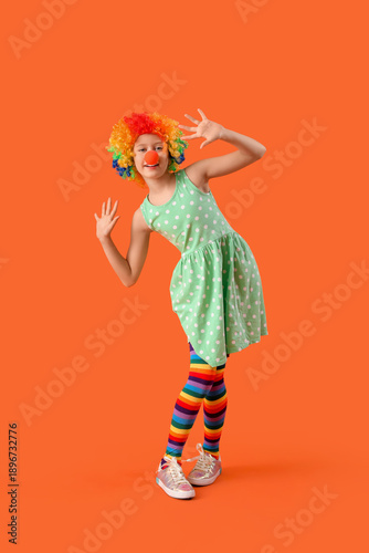 Funny girl in clown costume...