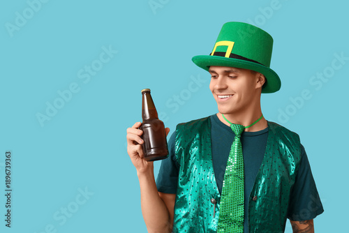 Happy young man in green cl...