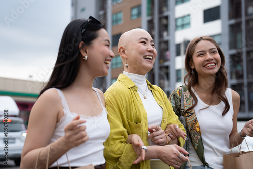 Diverse friends shopping together laughing and having fun