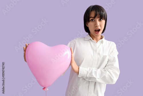 Shocked young woman with he...
