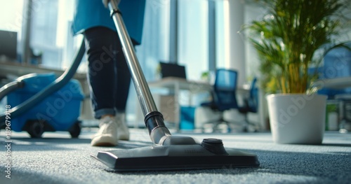Wallpaper Mural Professional Cleaner Vacuuming Carpet in Modern Office Space with Bright Natural Light Torontodigital.ca