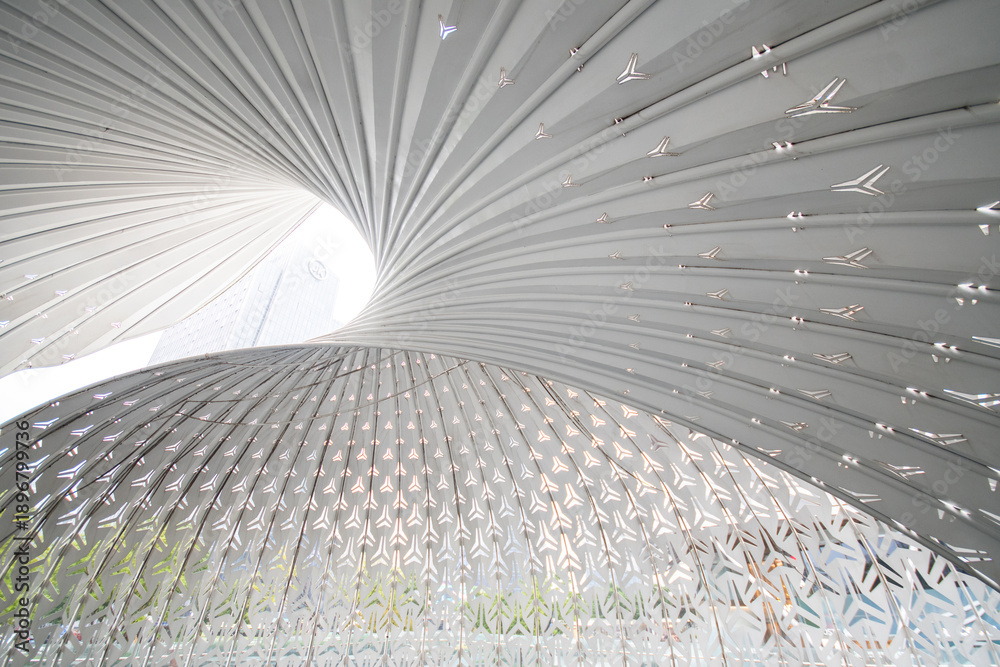 Obraz premium The Light and Shadow Nautilus art structure outside The Ring Shopping Mall in Chongqing, China.