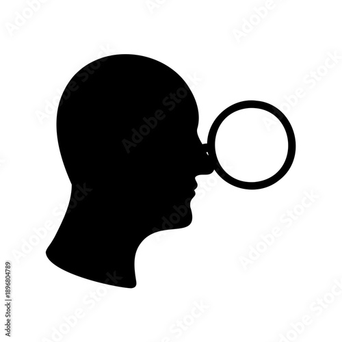 silhouette of a man looking through a magnifying glass