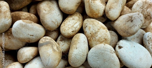 Close-Up of Smooth River Pebbles with Earthy Tones