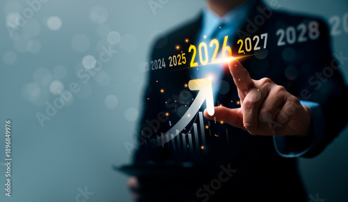 Canvastavla Business professional pointing at upward growth arrow highlighting year 2026 wit