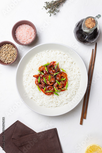 Quadro em tela Rice with fried shrimp in teriyaki sauce. Seafood. Asian cuisine.