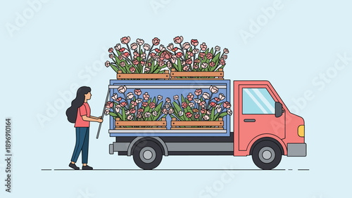 Young woman placing several crates filled with fresh pink flowers into the back of a red delivery truck for transport.