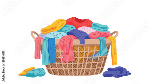 Large wicker laundry basket filled to the brim with a variety of colorful clothes ready for washing or folding.