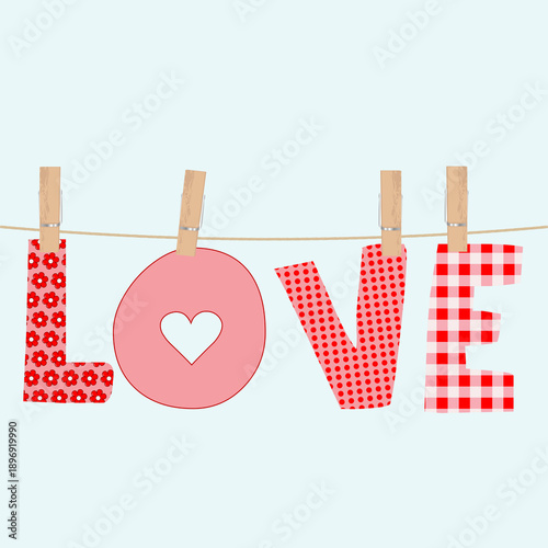 Colorful love word on clothes pegs,patterned letters clipped to a rope