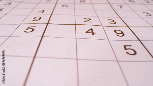 Photography CLOSE UP, BOKEH: Detailed view of grid and numbers in sudoku number puzzle