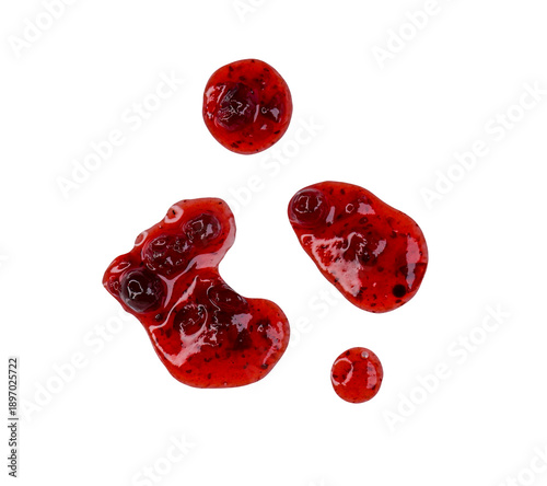 Drops and stains of liquid red berry jam or sauce isolated on transparent background, top view, PNG.
