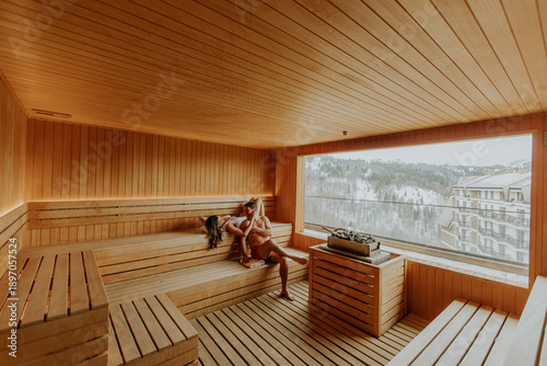 Two people relax in a woode...