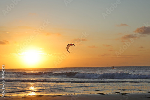 
Outdoor water sport, practicing skitesurfing in the waters of Jericoacoara, Ceará, Brazil. Sunset in summer time.