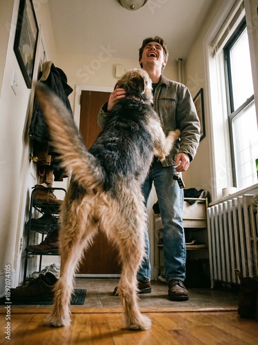 A dog jumping to greet its owner at the door, a heartwarming and authentic moment of unconditional love and pet connection.