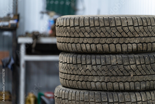 A stack of winter tires in a car repair shop