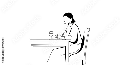 Woman sitting at a table with a glass of wine.