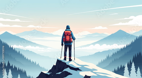 Hiker on snowy peak overlooking misty mountain ranges at sunrise