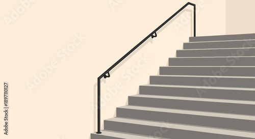 Gray steps with a black handrail against a light beige wall