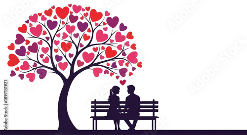 A loving couple sits beneath a heart shaped tree silhouette