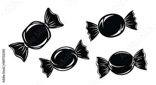 Four black candies arranged randomly showcasing a bold silhouette