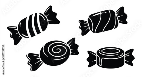 Four black candies displayed in a striking silhouette