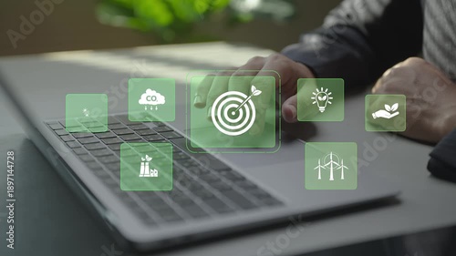 Digital sustainability management with virtual icons for green energy, carbon reduction and ESG metrics. Business professional monitoring sustainability goals and environmental performance online.