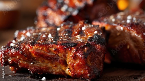 Juicy Barbecued Meat with Charred Edges and a Sprinkle of Sea Salt on a Rustic Wooden Table
