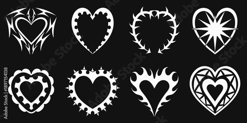 Collection of ornate white heart designs on a black background