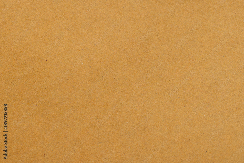 Fototapeta premium Brown Kraft Paper Texture Background for Creative Design,Macro,A high-resolution, close-up shot of a natural brown kraft paper texture with subtle fiber details, ideal for rustic backgrounds,
