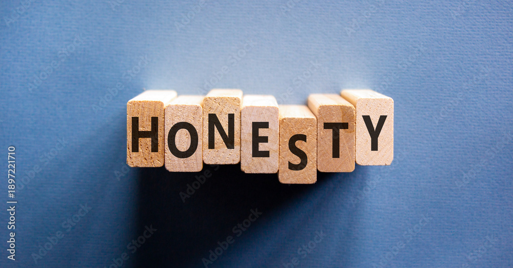 Naklejka premium Honesty word symbol. Concept word Honesty on beautiful wooden blocks. Beautiful blue background. Business honesty concept. Copy space.