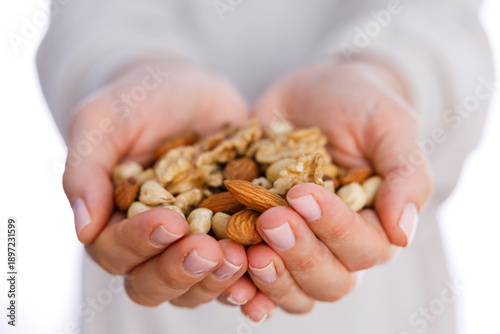 Hands holding mixed nuts