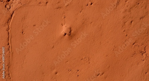 Warm Rustic Clay Plaster Wall Background with Natural Earthy Texture and Organic Surface Detail