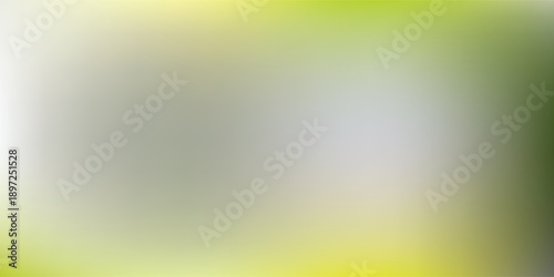 Abstract blurred background with soft green and yellow tones.