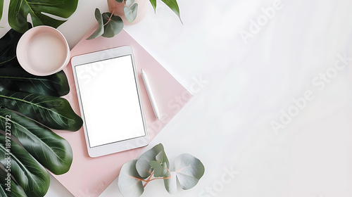 Elegant Workspace Setup with Tablet and Notebook