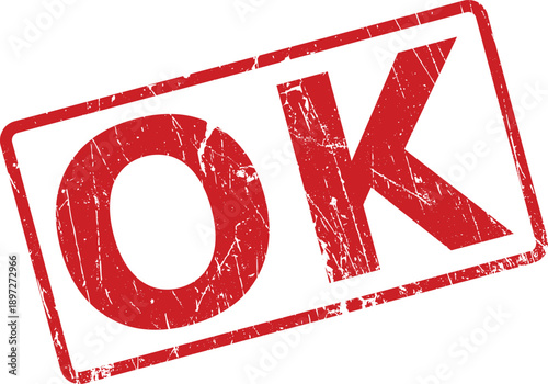 Vivid red grunge rubber stamp with the simple two letter word OK centered on a white background